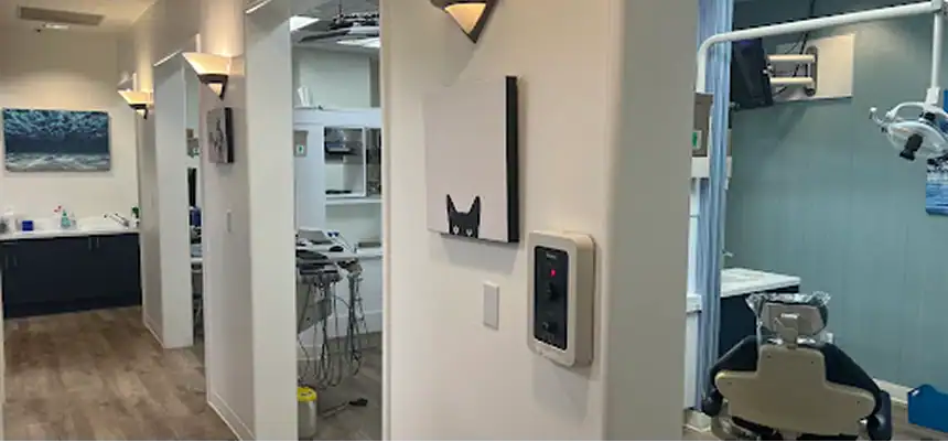 A modern dental clinic interior with treatment rooms and dental equipment.