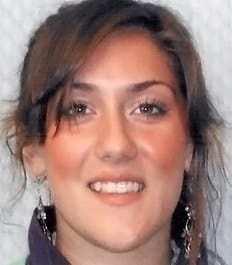 A smiling woman with crowding issues